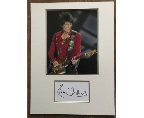 Ronnie Wood Rolling Stones Music autograph on white card matted with colour photo into display approx 16 x 12 inches. Good Co