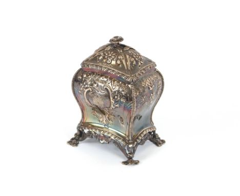 An Edwardian silver tea caddy, of baluster form, having embossed floral decoration and monogrammed cartouche to the body, rai