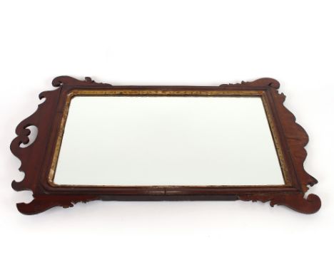 A 19th Century mahogany Chippendale style wall mirror, having fret carved frame and gilt slip, 77cm x 48cm overall