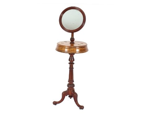 A Victorian mahogany shaving mirror, the circular adjustable mirror raised on a lift-flap compartment, turned baluster column