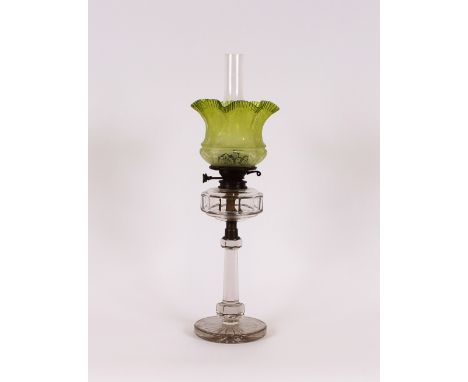 A Victorian table oil lamp, with cut glass column and reservoir, green tinted etched shade, 26.5cm high overall