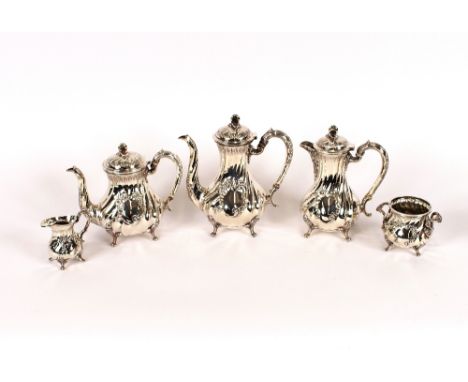 A 5 piece plated tea set, of baluster form having floral scroll and cartouche decoration, comprising teapot, coffee pot, hot 