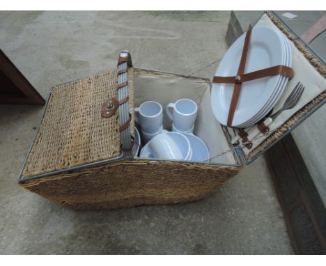 A picnic hamper and contents