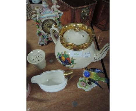 A selection of mixed ceramics including clock and teapot