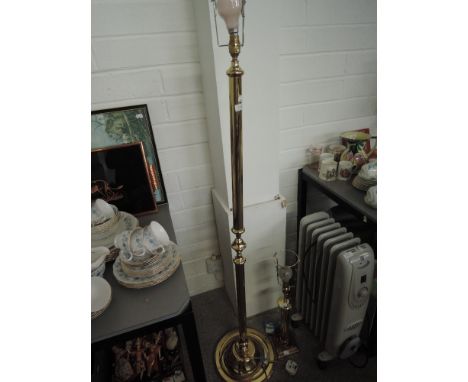 A brass effect standard lamp and matching table lamp