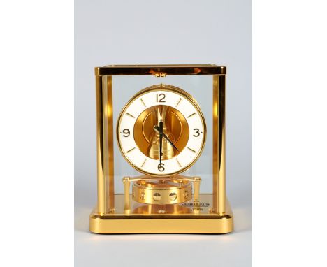 Boxed Jaeger-LeCoultre Atmos Clock, white enamel chapter ring with gilt numbers and batons No687443. Complete with instructio