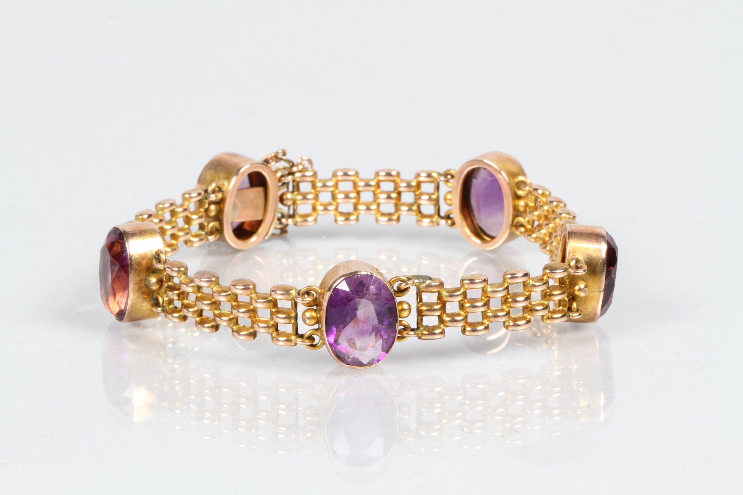 Ladies 9 carat gold bracelet with five set amethyst stones, total