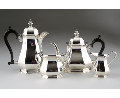 Four piece silver tea service, faceted form, ebony handles, assay marked Sheffield 1956, approx. 72ozs 