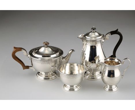 Four piece silver tea service including a teapot, coffee pot, sugar basin and cream jug, all decorated with an engraved scrol