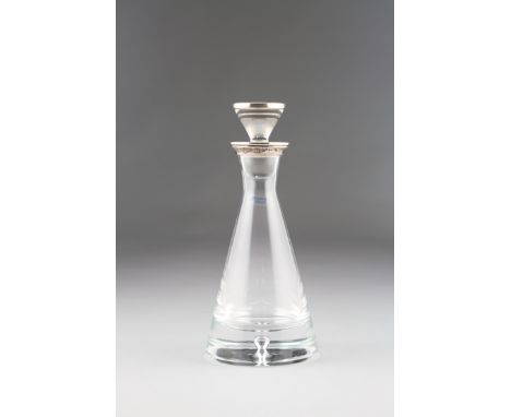 Silver topped crystal decanter of ovoid form, raised on a circular foot, silver neck and spout with scroll handle by J.A. Cam