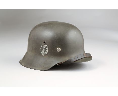 World War II German Third Reich SS steel helmet, SS Rune decal to one side, original leather liner with black leather chin st