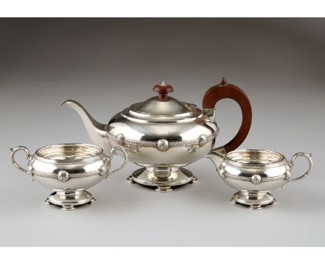 1920s three piece silver tea service, squat circular form raised on large circular base raised on stepped demi lune feet, Cel