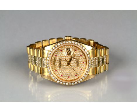 Gents 18K gold day-date Rolex wrist watch, pave diamond dial, with rubies to hours, brilliant cut diamond set Bezel, self win