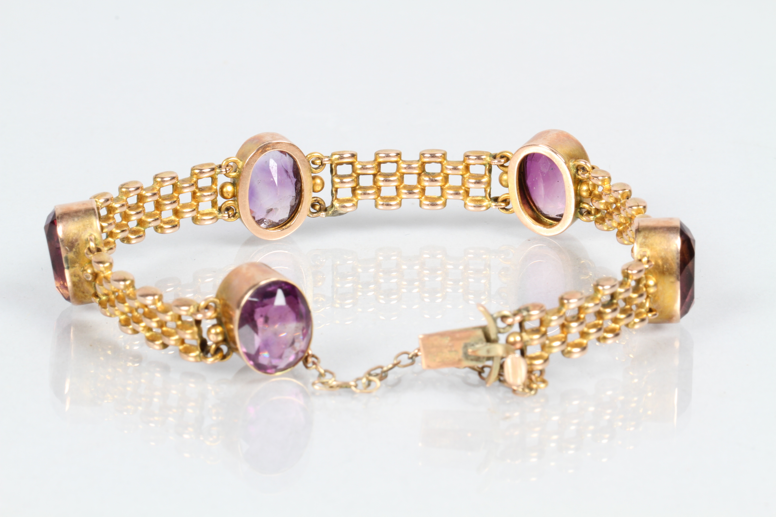 Ladies 9 carat gold bracelet with five set amethyst stones, total