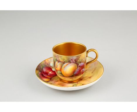 Royal Worcester coffee cup and saucer, hand painted with fruit in a naturalistic background, signed Townsend, cup with gilt i