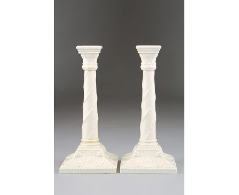 Royal Worcester ceramic candlesticks, Corinthian columned with square bases, date coded 1955. 26cm high 