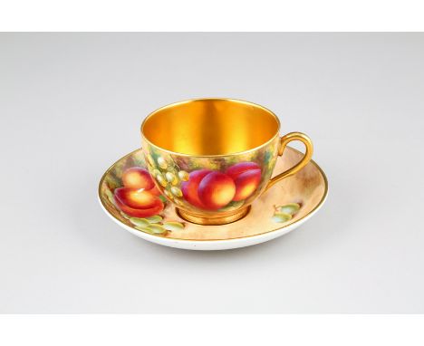 Royal Worcester tea cup and saucer, hand painted with fruit in a naturalistic background, signed Ayrton, cup with gilt interi