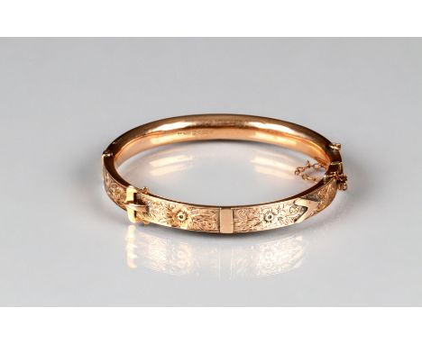 Boxed Edwardian ladies 9 carat rose gold stiff bangle with engraved and chased foliate decoration, total weight 9.6 grams 