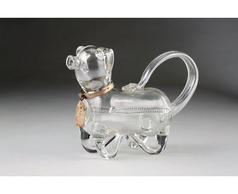 Glass decanter in the form of a pig, silver collar and whisky tag, Assay marked London 1908. 27cm long 18cm high 