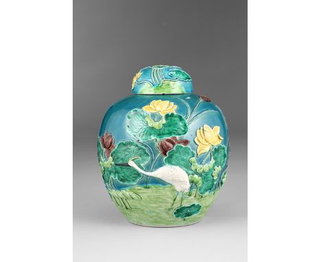 Chinese ginger jar and cover, decorated in relief, an egret amongst pond lilies, seal mark to base. 26cm high