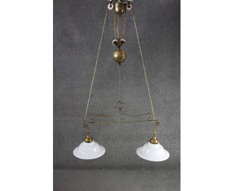 A French brass rise and fall ceiling light with original opaque white glass shades. H.100 W.70cm 