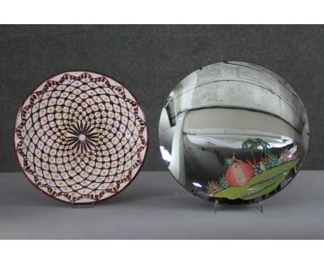 A vintage hand painted circular mirror with a lady in a garden along with a Islamic pattern ceramic charger. 
Diam. 35 cm (la