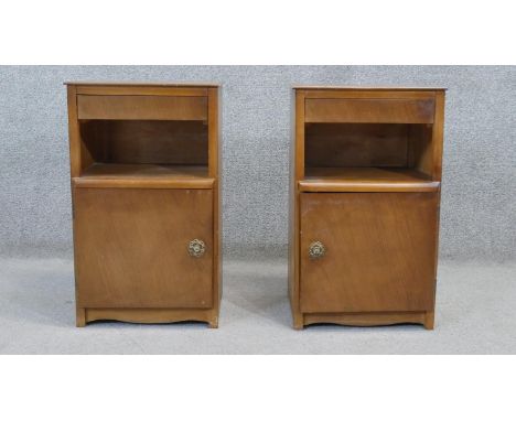 A pair of mid century walnut Art Deco style bedside cabinets. H.60 W.37 D.28 cm 