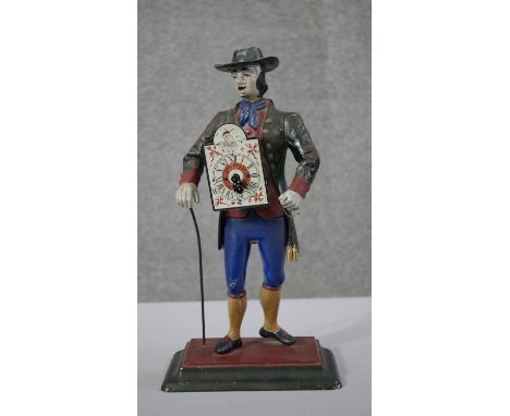 A vintage Dutch painted cast iron pedlar figure mantle clock (no pendulum) with hand painted dial. H.38 W.20 D.11 cm 