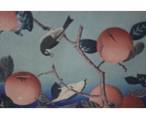 A framed and glazed 19th century Japanese woodblock print of birds in a persimmon tree, with artists seal. H.33 W.42 cm. 