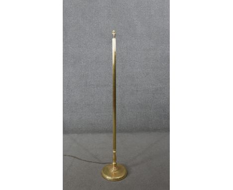 A vintage brass standard lamp with fluted column design and circular base. H.144 Diam.27CM 