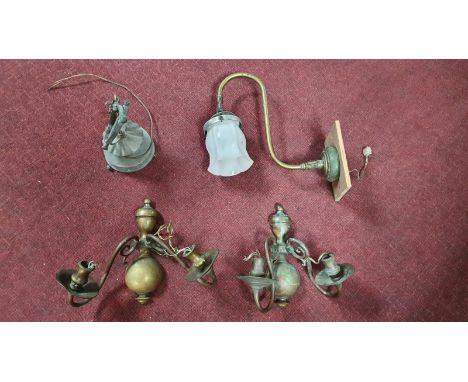 Four vintage wall mounted light fittings. A pair of two branch brass wall lights with scrolling design and other light fittin