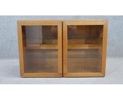 A vintage teak wall mounted cabinet. H.56 W.84 D.27cm (Originally wired with internal light). 