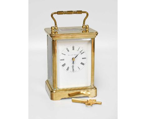 A Brass Matthew Norman Carriage Timepiece, with fitted case, gurantee and instruction booklet, 17.5cm high over handle, toget