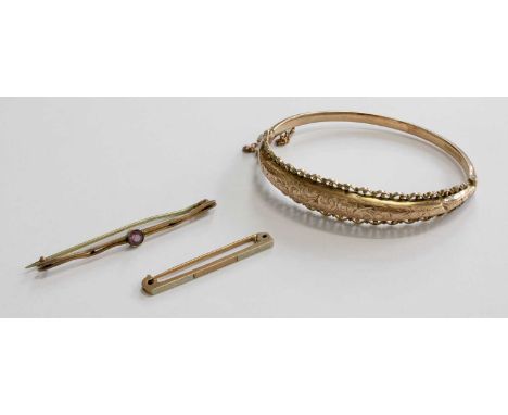 A 9 Carat Gold Hinged Bangle, measures 6.0cm by 5.1cm; A 9 Carat Gold Tie Pin, length 3.9cm; and Another Brooch, stamped '9CT
