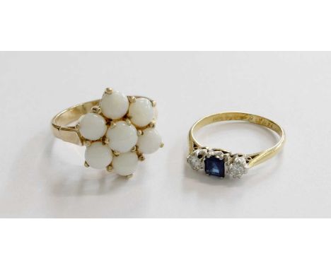 A 9 Carat Gold Opal Cluster Ring, finger size N; and A Sapphire and Diamond Three Stone Ring, stamped '18C', finger size K  O