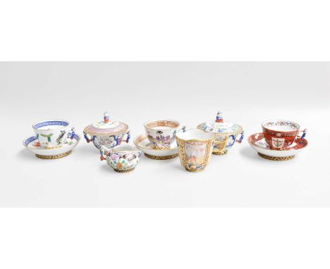 Herend Porcelain, a collection of teacups and suacers, sucrier, sparrow beak jug and a quatrefoil cup, decorated in chinoiser