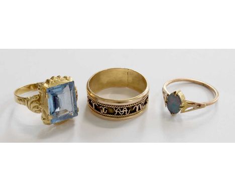 Three Rings, comprising of an opal triplet ring, stamped '9CT', finger size O1/2; a synthetic blue spinel ring, indistinctly 