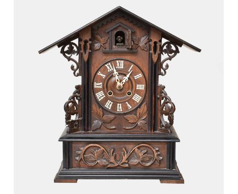 A Cuckoo Table Clock, circa 1900, movement stamped GHS, architectural case with relief foliate scroll decoration, 46cm highTh