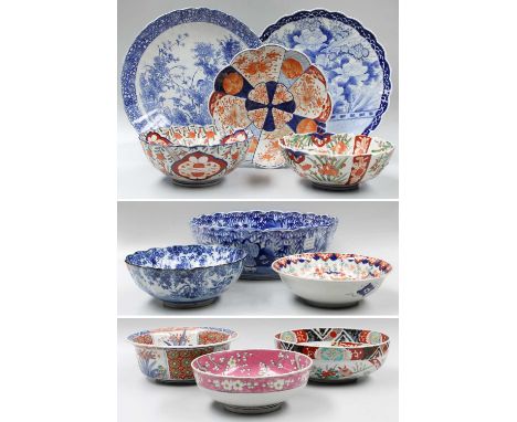 A Japanese Imari Deep Bowl, four other Imari bowls and a dish, two Japanese Arita blue and white chargers, two similar bowls,