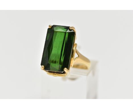 AN 18CT YELLOW GOLD, GREEN TOURMALINE RING, designed with a rectangular cut deep green tourmaline measuring approximately 17.