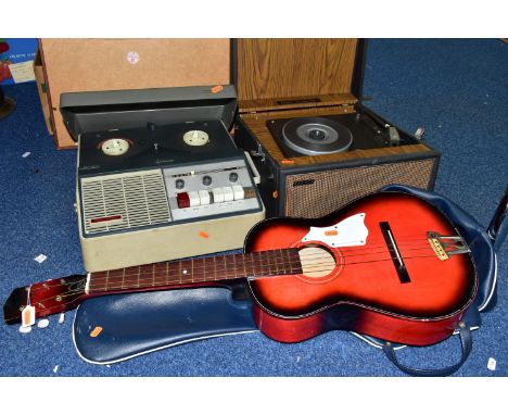 A CHILD'S ACOUSTIC GUITAR, A PORTABLE RECORD PLAYER AND A REEL TO REEL TAPE RECORDER, comprising a red painted wooden guitar 