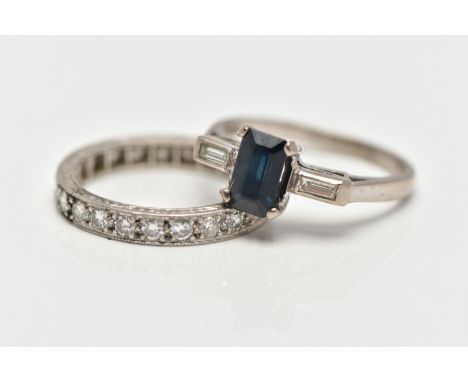 TWO WHITE METAL GEM SET RINGS, the first set with a rectangular cut sapphire, prong set, flanked with two bezel set baguette 