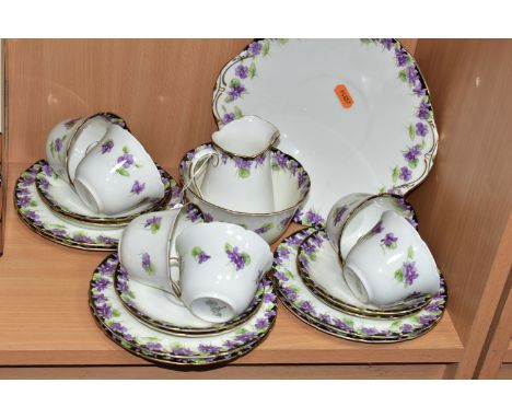 A TWENTY ONE PIECE ROYAL DOULTON VIOLETS H3747 TEA SET, comprising a cream jug, a sugar bowl, a cake plate, six teacups, six 