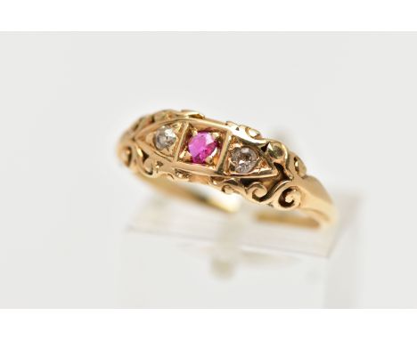 AN EARLY 20TH CENTURY 18CT GOLD RUBY AND DIAMOND RING, set with a central circular cut ruby, flanked with two single cut diam