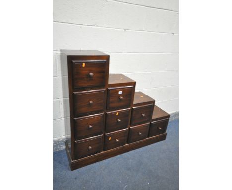 A HARDWOOD STEP STORAGE CHEST OF TEN DRAWERS, width 120cm x depth 33cm x height 110cm