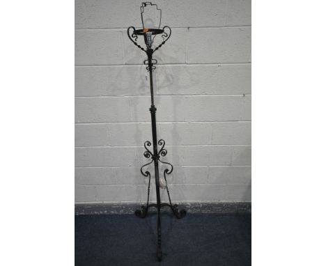 A WROUGHT IRON TELESCOPIC STANDARD LAMP, with scrolled and twisted decoration, maximum height 173cm x lowest height 150cm (co