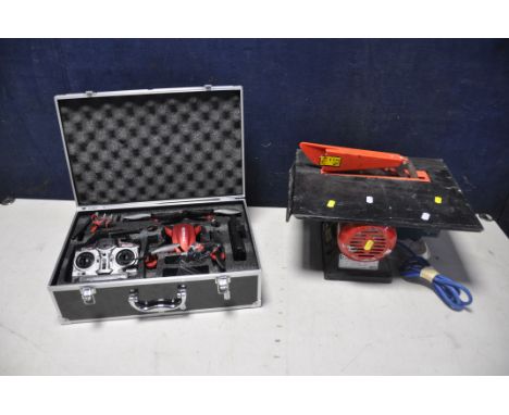 A POTENSIC MINI DRONE WITH CAMERA in case with spare parts and controller along with a Clarke woodworker CTS800 table saw (bo