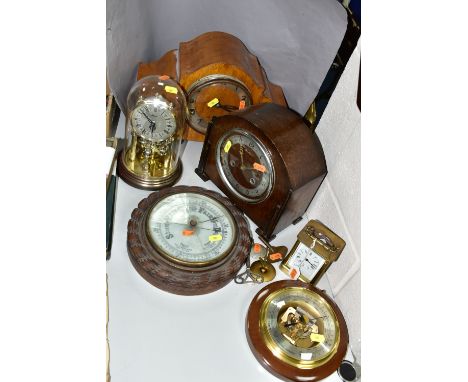 FIVE CLOCKS AND TWO BAROMETERS, comprising a Weston Super quartz wall clock, Hermle quartz anniversary clock, brass carriage 