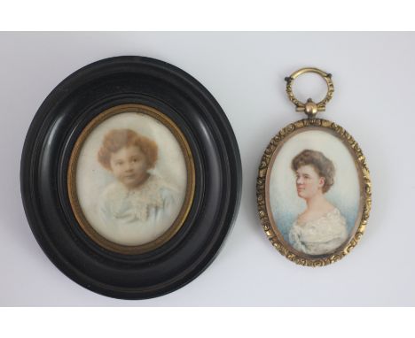 A portrait miniature pendant, 19th century, oval, watercolour on ivory depicting a lady with up-swept hair, wearing lace trim