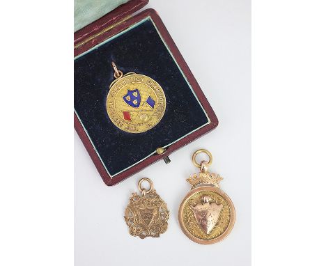 SHROPSHIRE INTEREST: A 9ct gold and enamel The Football Combination Championship football medal to C. Bull, Whitchurch F.C. d